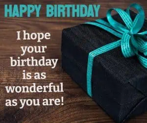 Happy Birthday with a black gift and teal ribbon